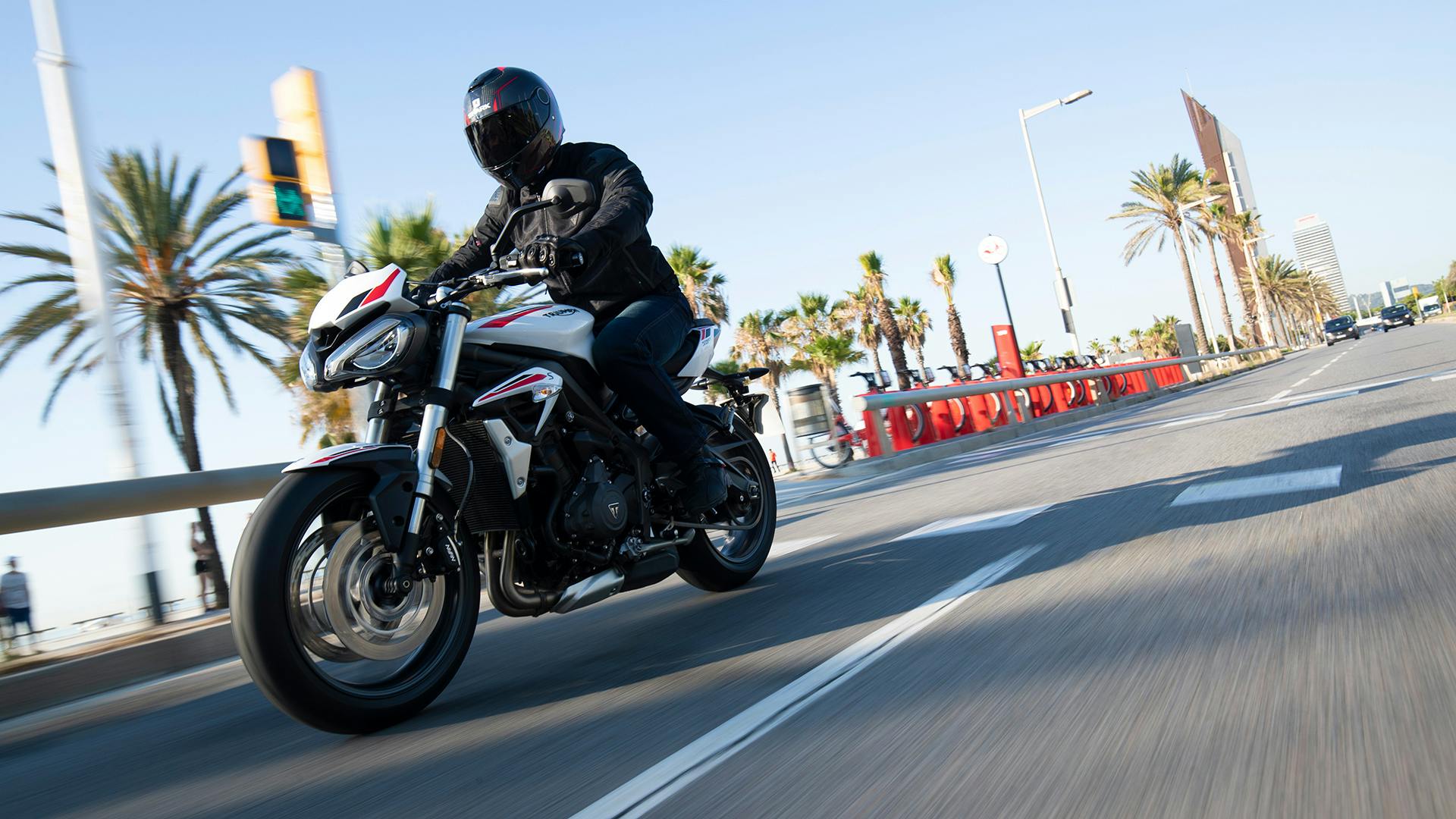 Triumph Street Triple S in crystal white colour on the road