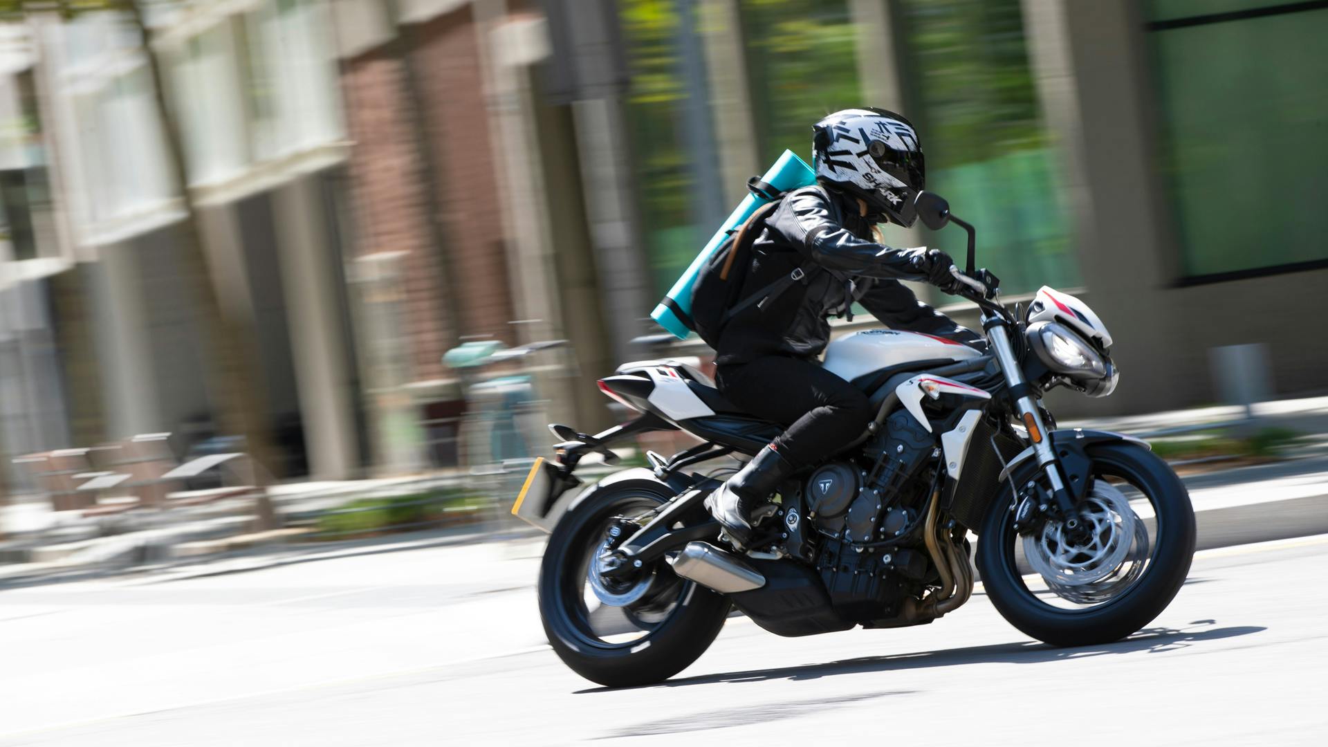 Triumph Street Triple S in crystal white colour on the road