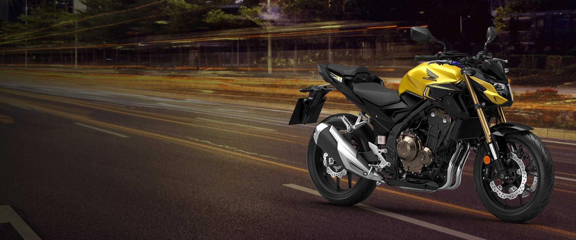 Honda CB500F in pearl dusk yellow colour, parked