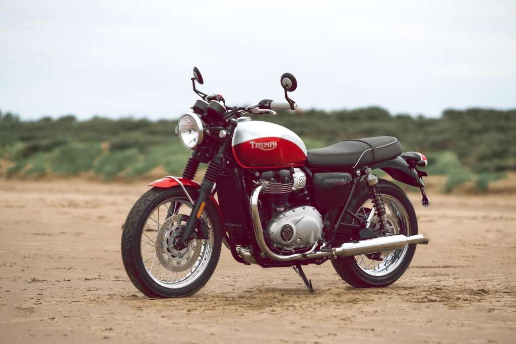 Triumph Bud Ekins T100 in red and white colour parked.