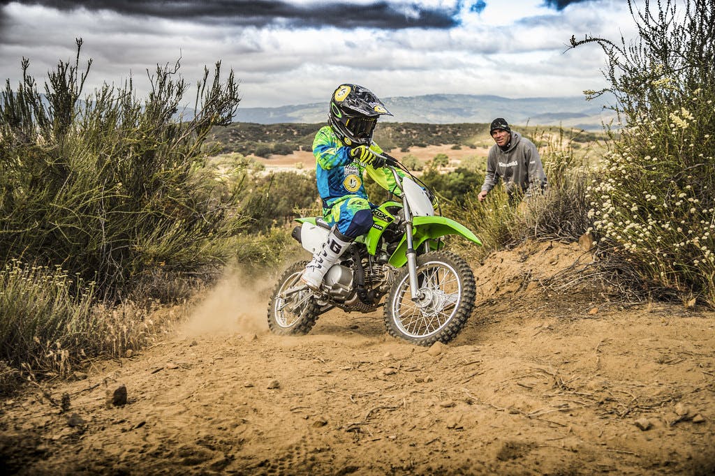Kawasaki KLX110R in Lime Green colour on track