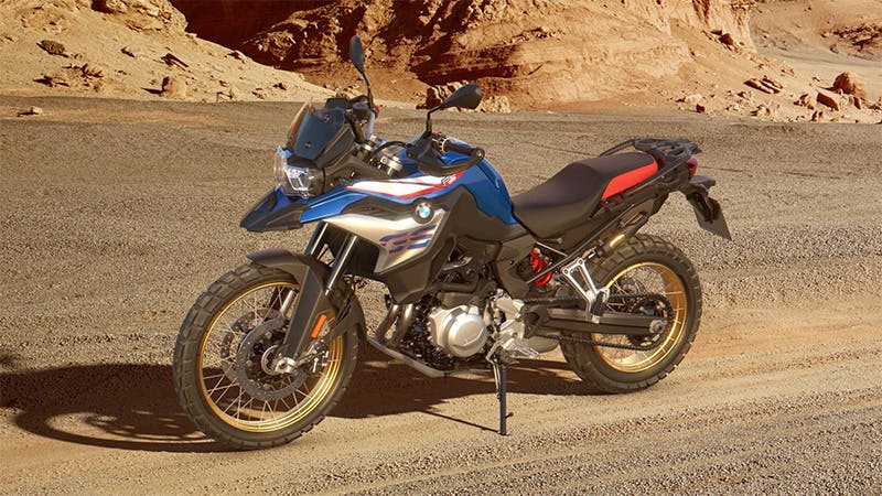 BMW F 850 GS Rallye motorcycle being ridden on a hill road