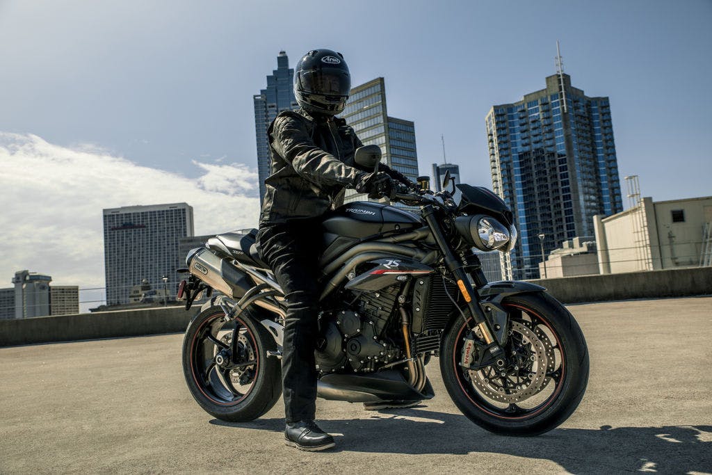 TRIUMPH SPEED TRIPLE S in matt jet black colour, with a rider