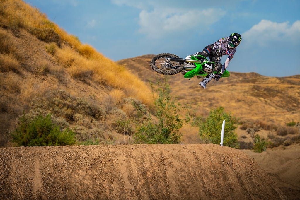 KawasakiI KX250 in lime green colour on off-road track