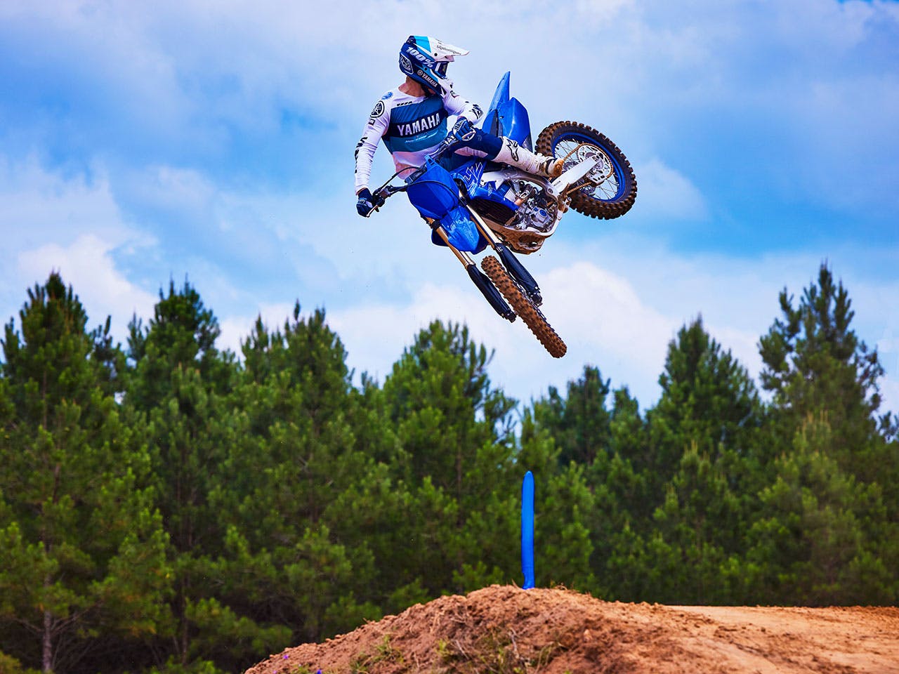 Yamaha YZ450F in team yamaha blue colour, being ridden off-track