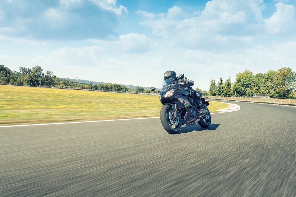 KAWASAKI NINJA 650L in metallic spark black colour, being ridden on a road