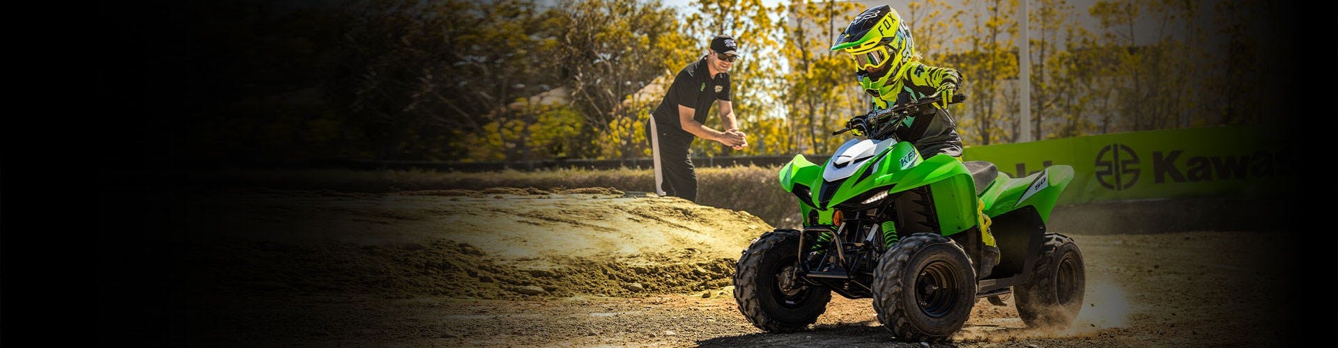 Kawasaki KFX50 in lime green colour on off road track