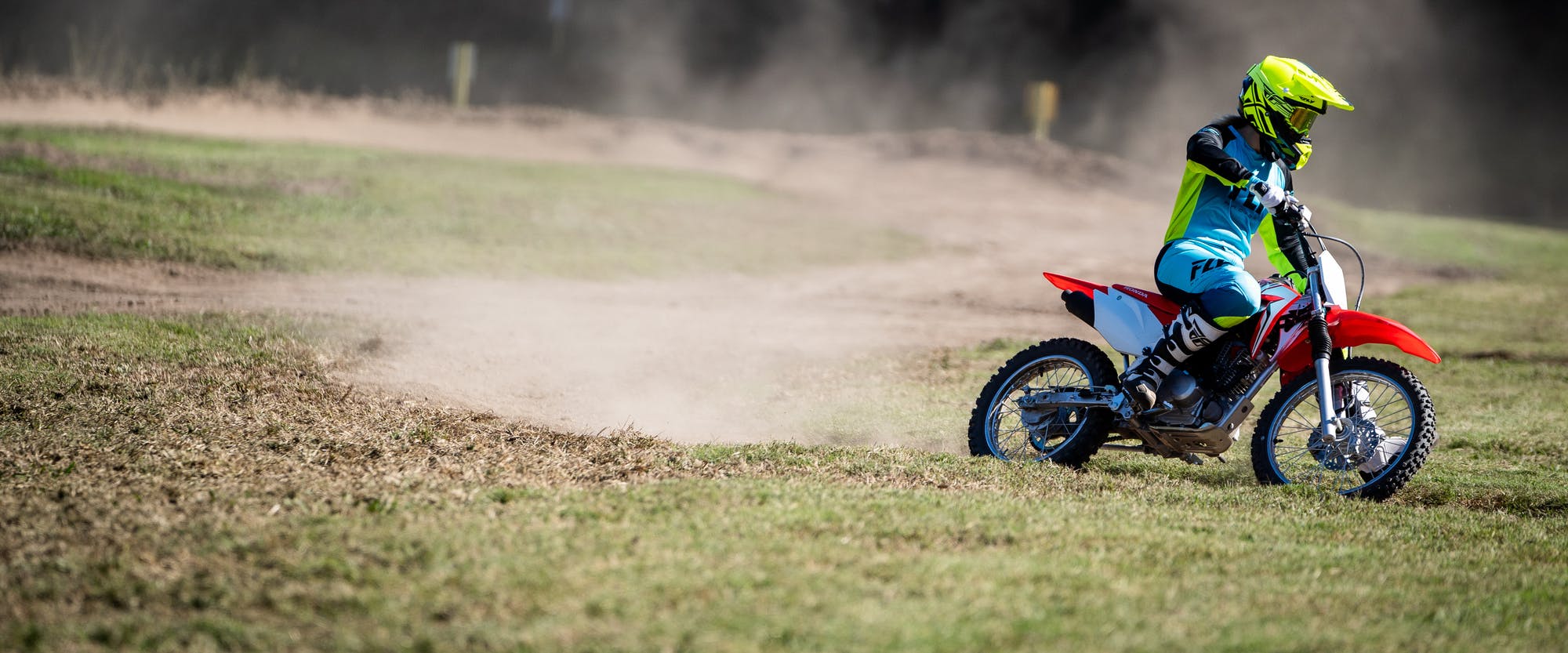 Honda CRF125F in extreme red colour on off road track