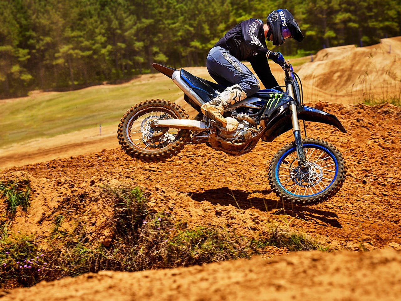 Yamaha YZ450FSP on Monster Energy Yamaha Racing Edition in action off road.