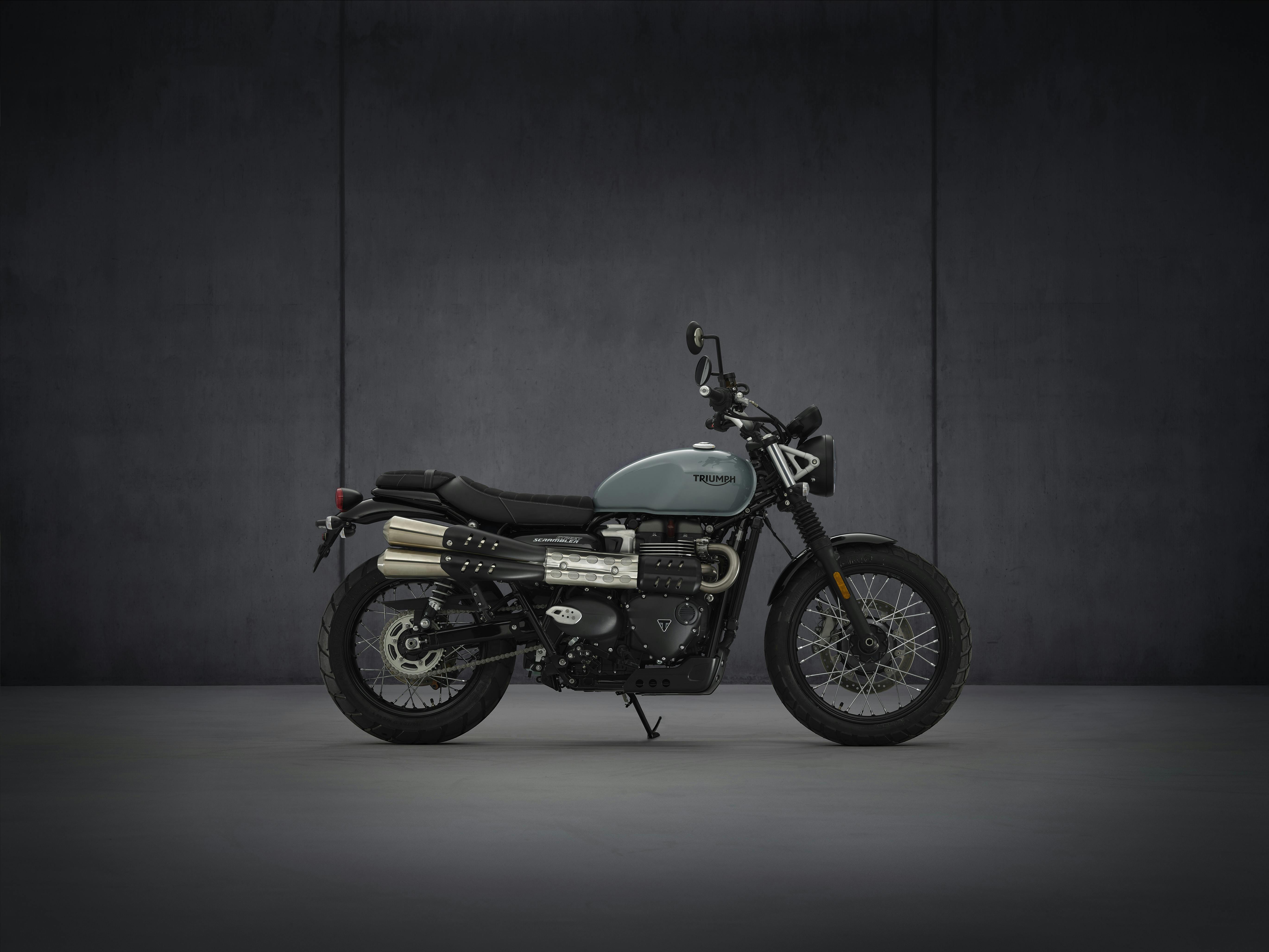 Triumph Street Scrambler in urban grey colour, parked.