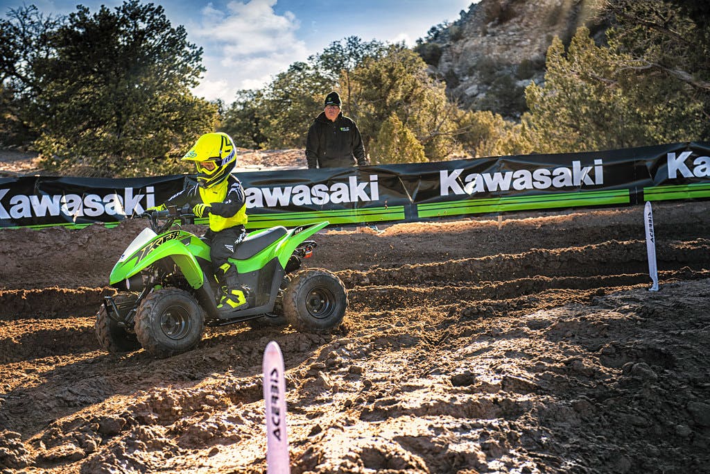 Kawasaki KFX50 in Green colour in action on dirt track