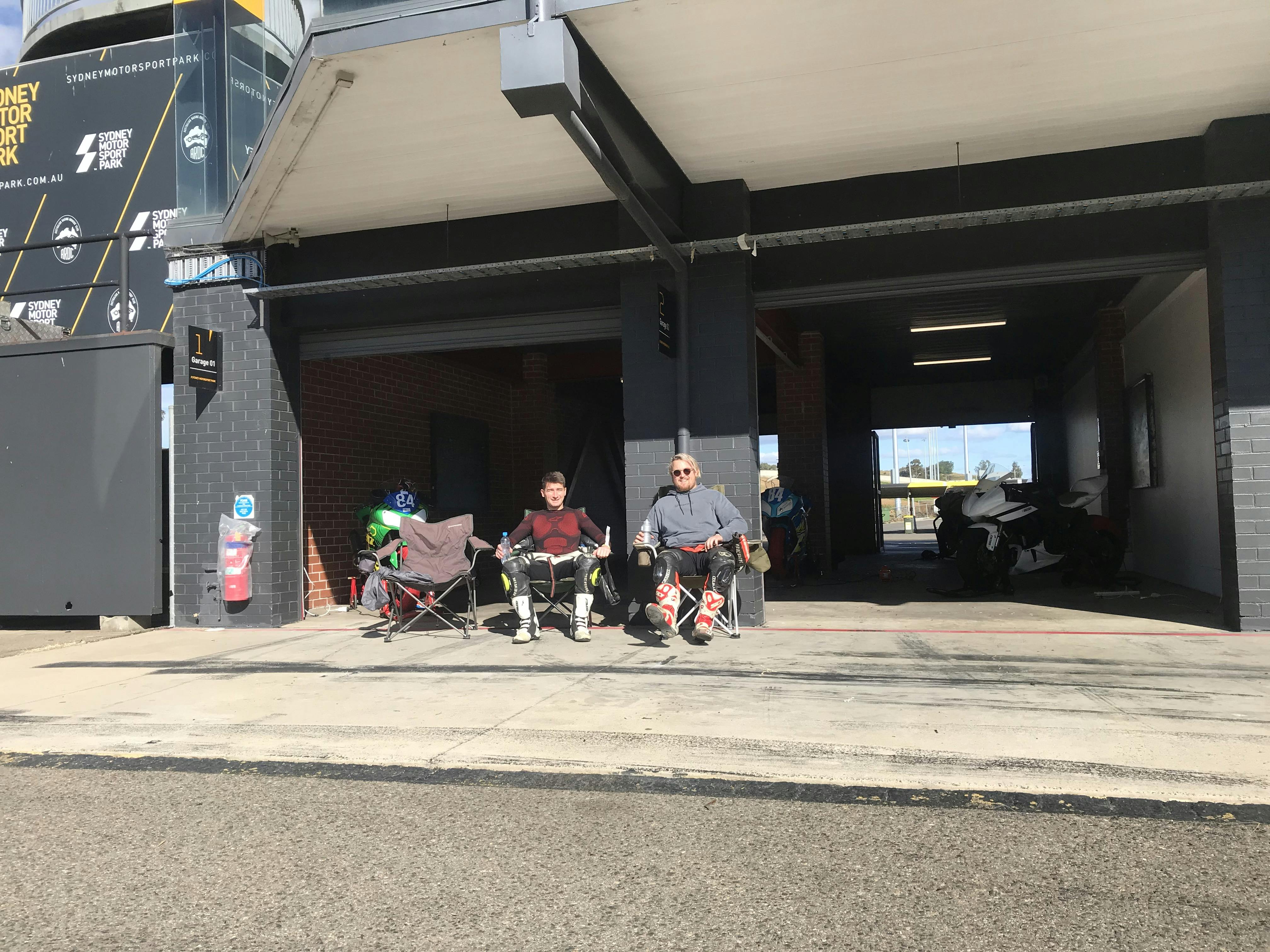 2 guys sitting in chairs in the sun at SMSP