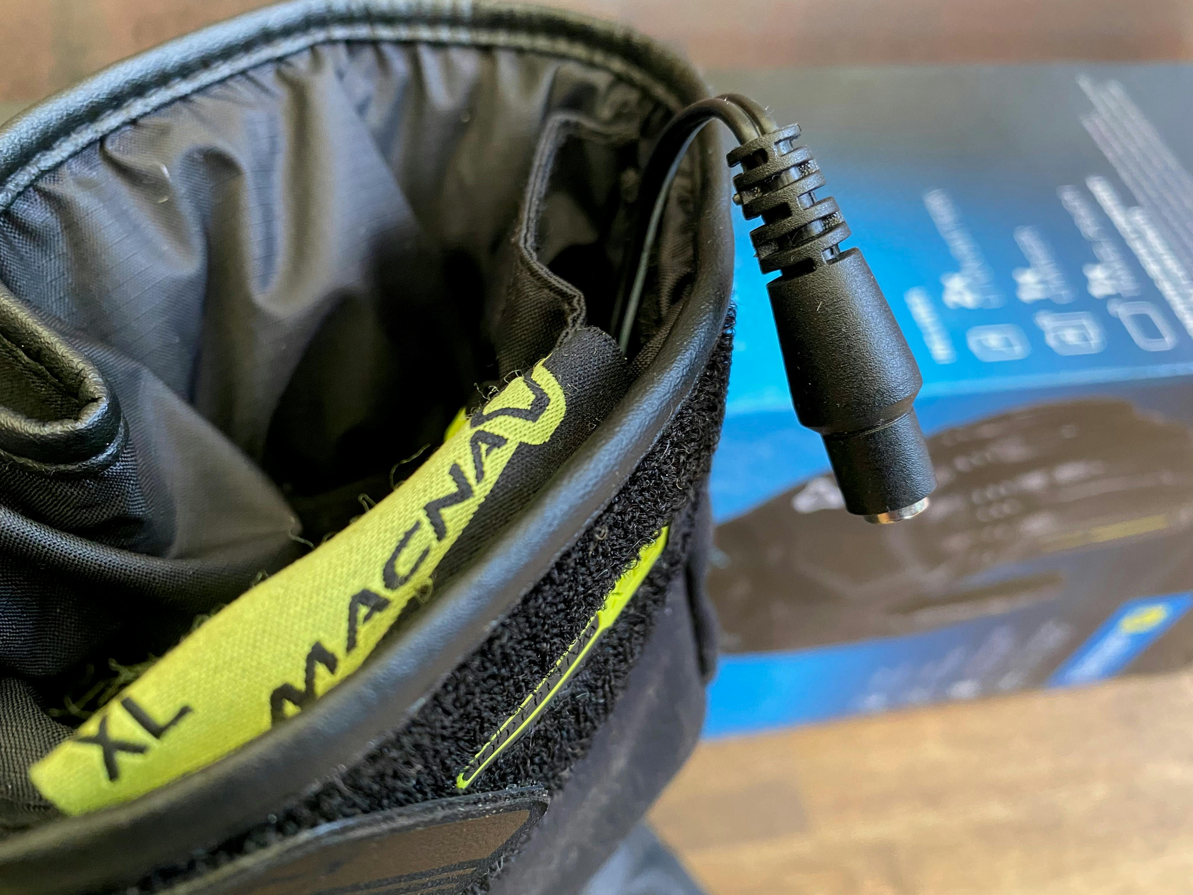 The connection cable hanging out of the glove in the Macna Ion