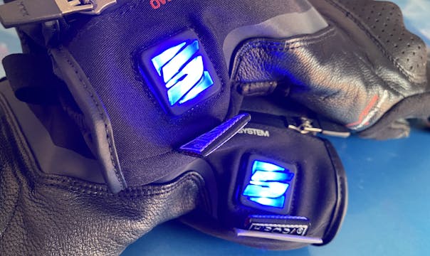 Blue lights lit up on Five heated gloves