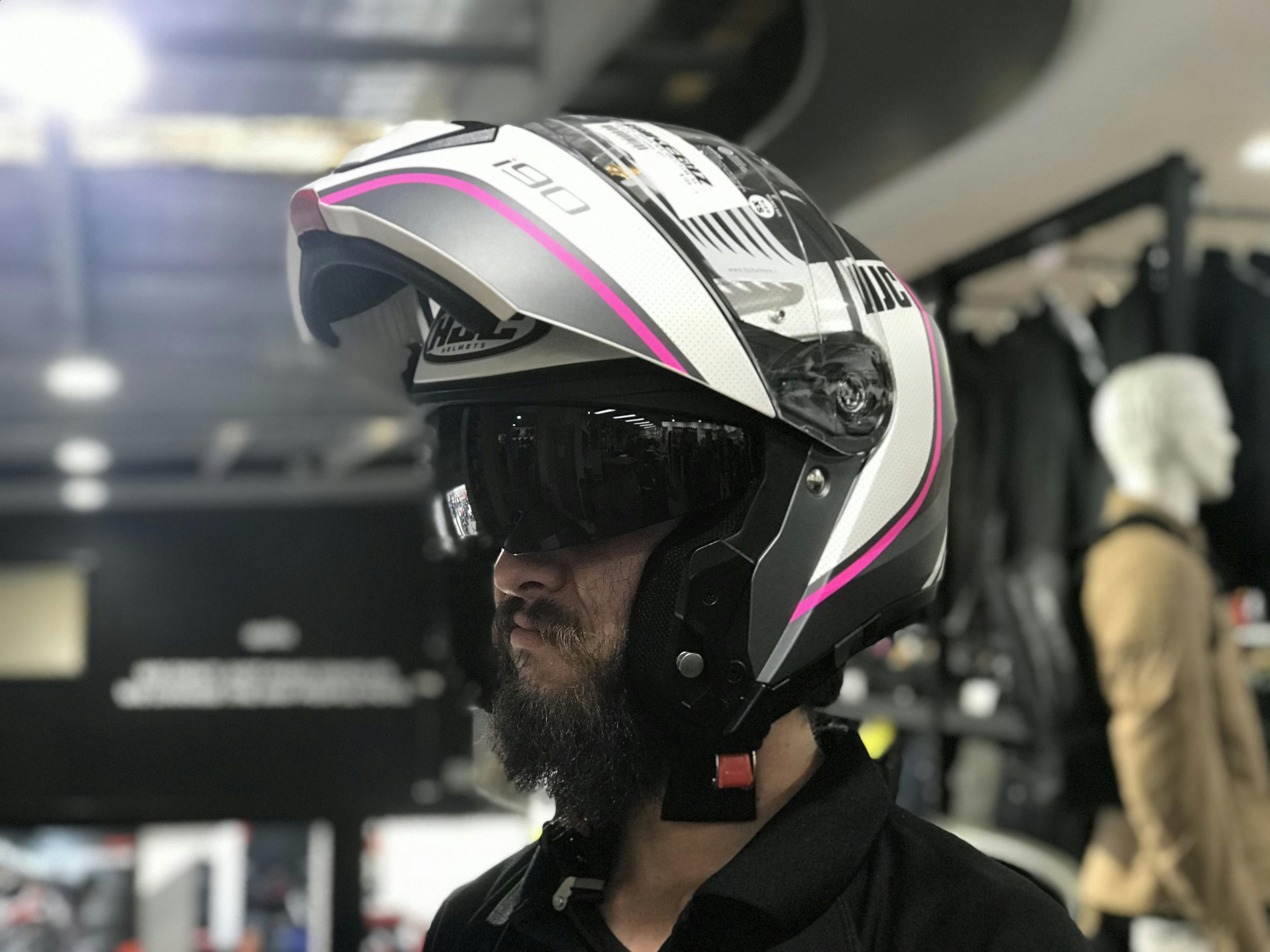 Andrew in a modular helmet white and pink