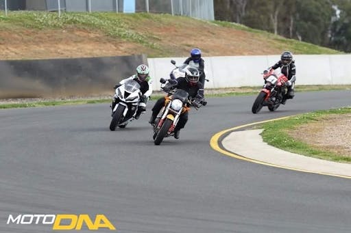 4 motorcycles on the track