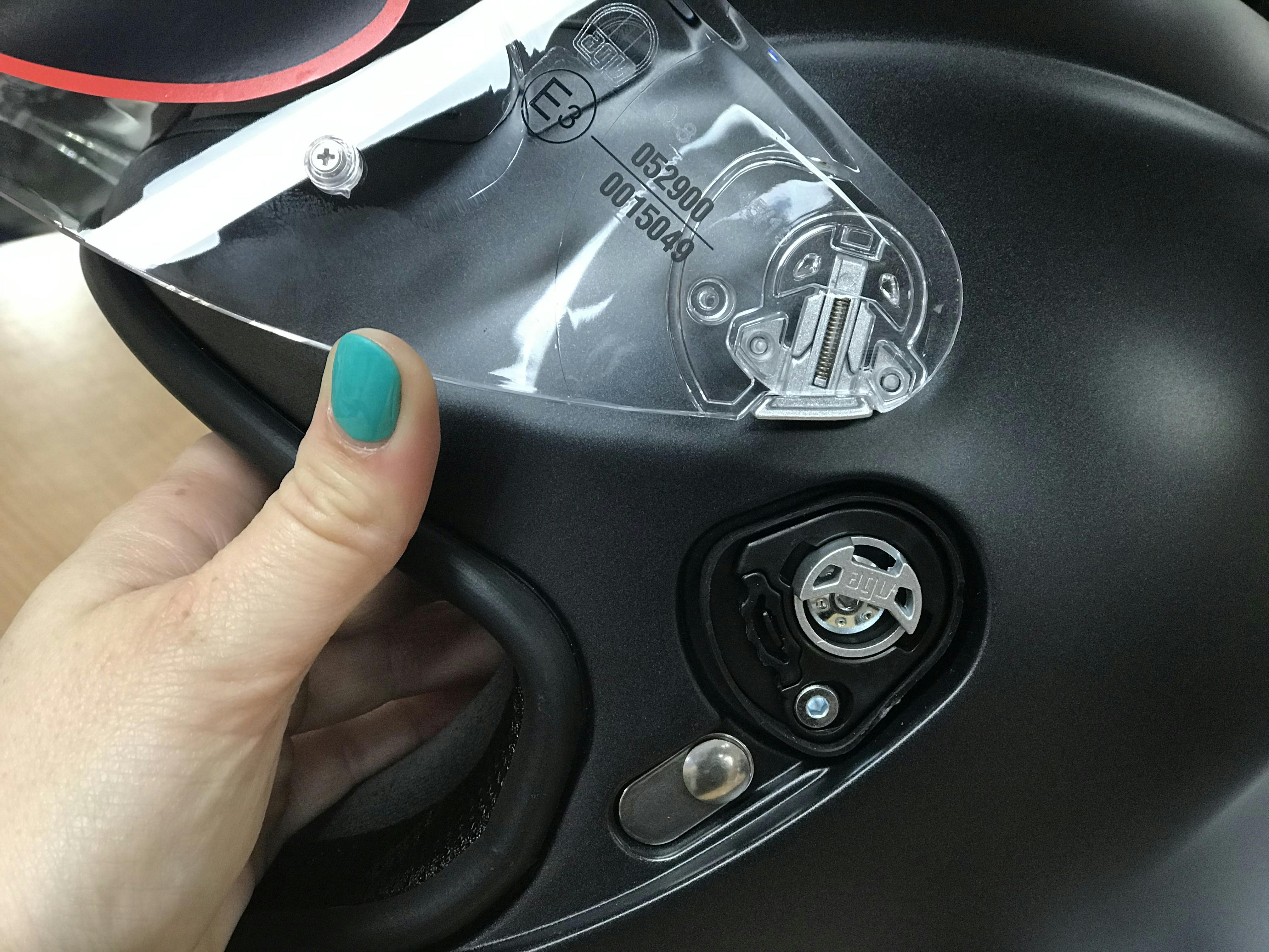Open visor mechanism on AGV K6 road helmet