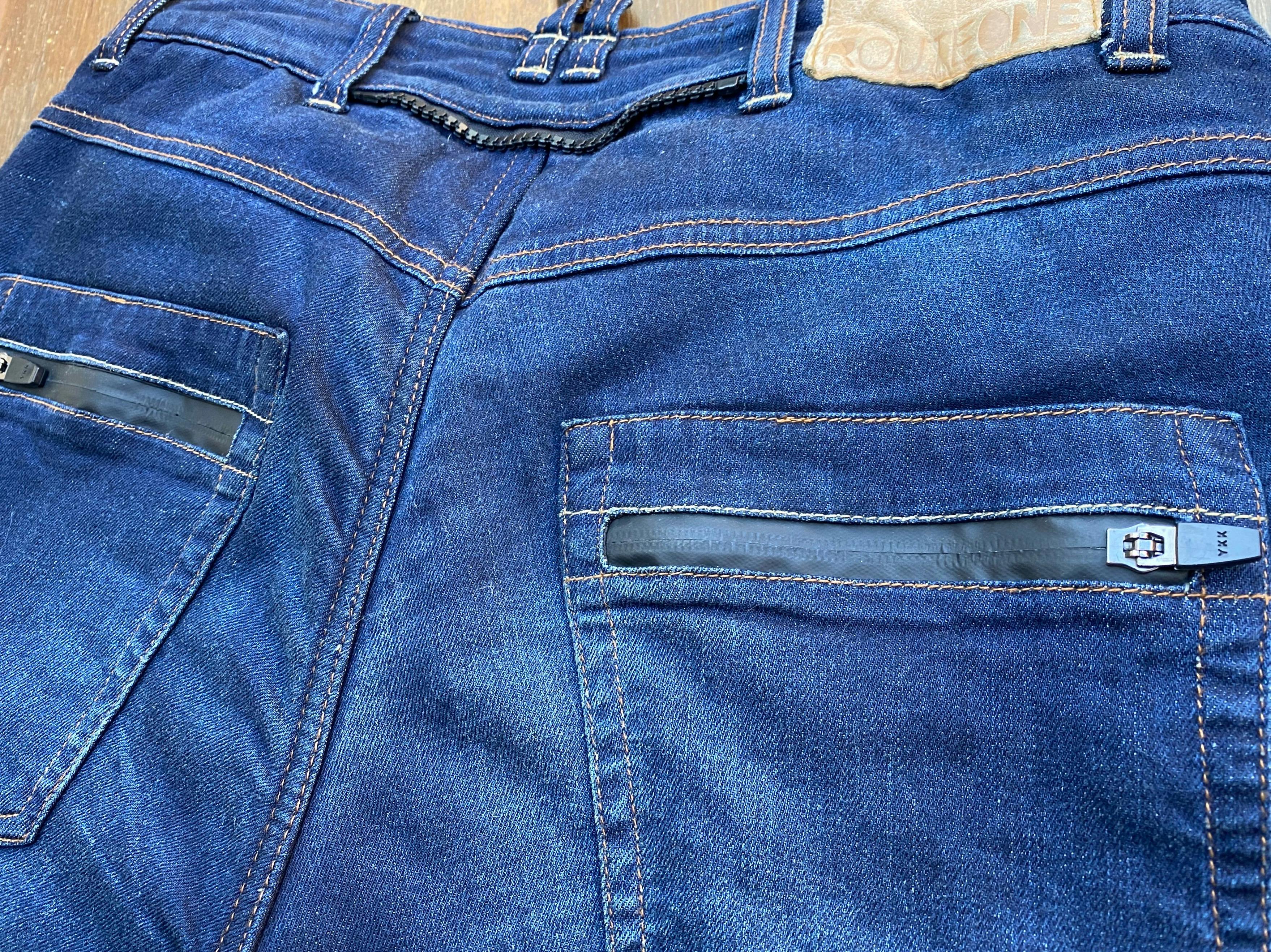 Heat welded tape to create a waterproof pocket on the back of a pair of blue merlin Mason jeans