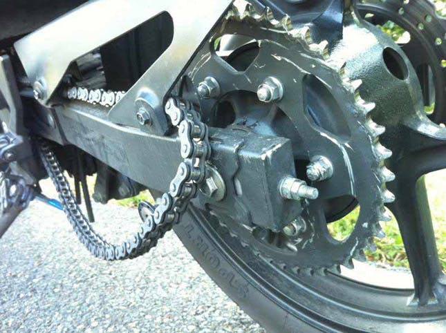 A motorcycle chain off the sprocket