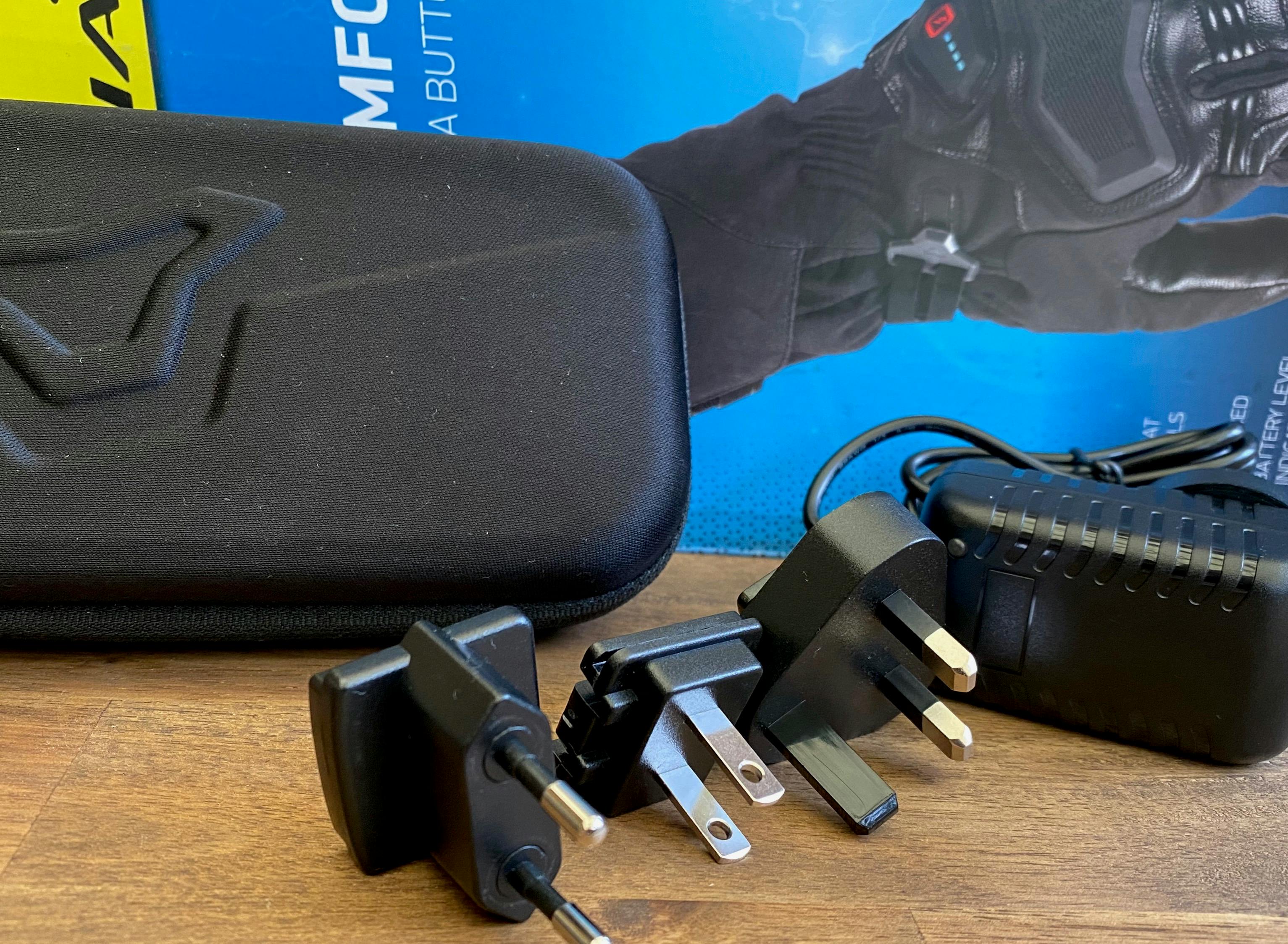 The wall charger with carry case and power adaptors that come with the Macna Ion glove