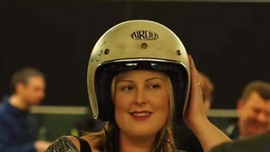A woman in an Open Face helmet