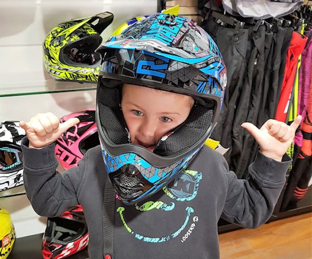 Young boy in dirt bike helmet