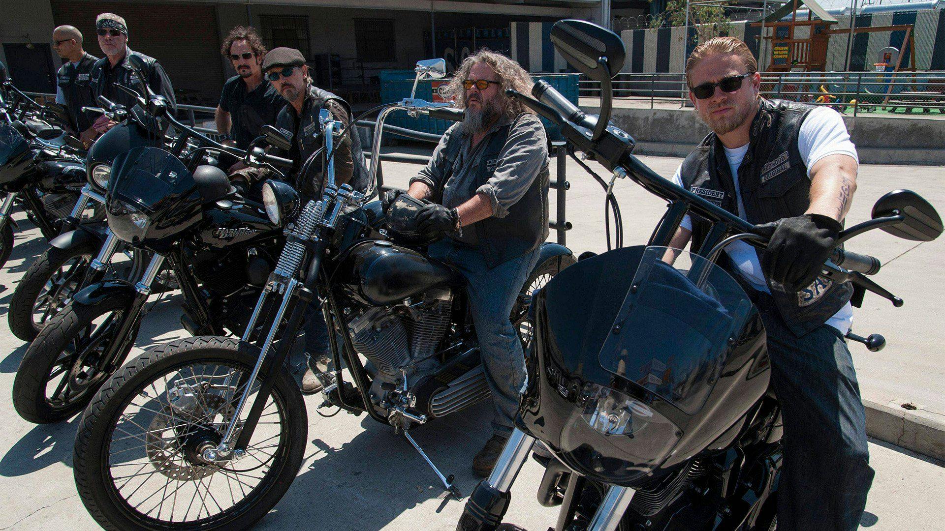 Some of the sons of anarchy cast on motorcycles