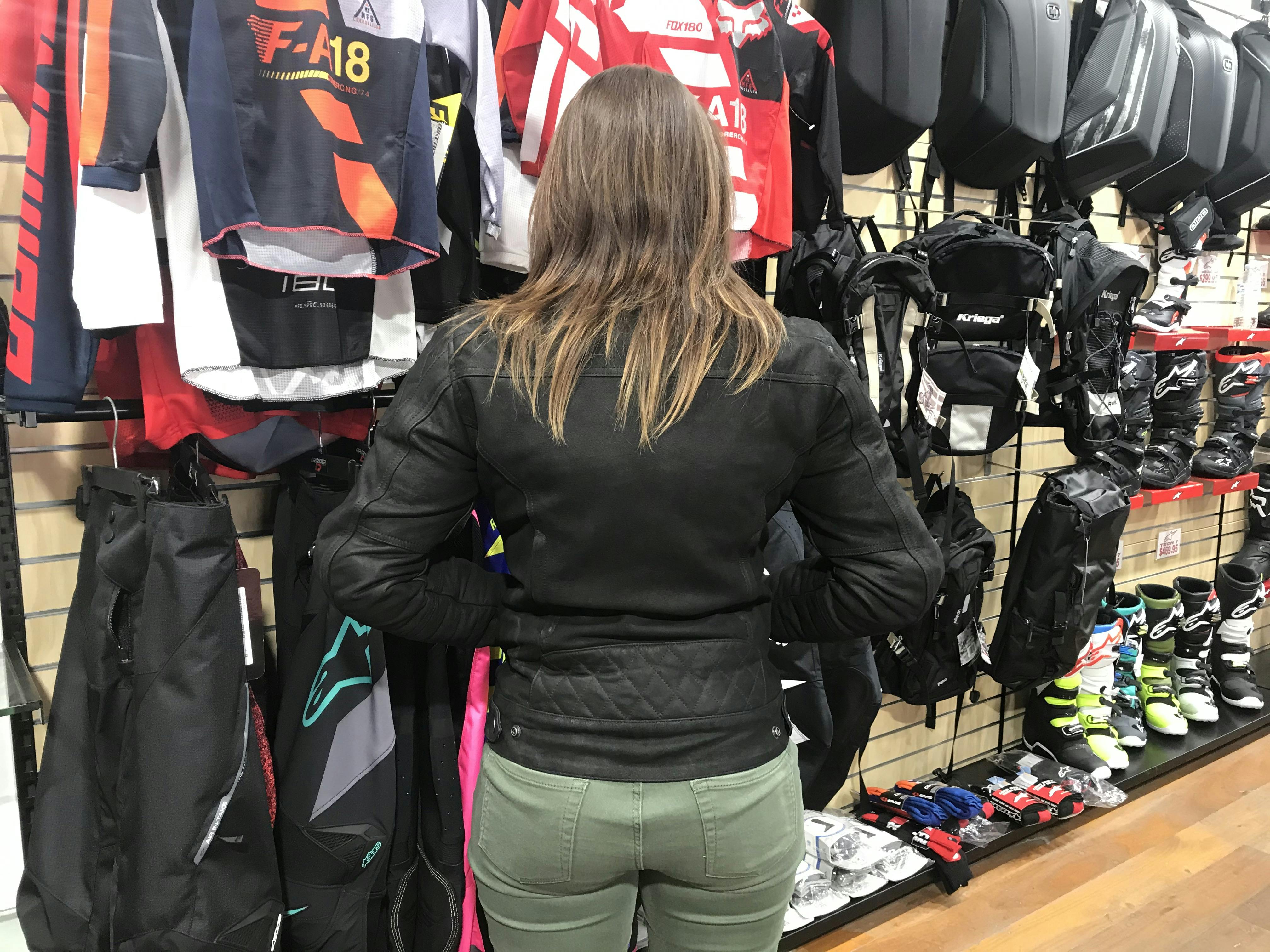 woman wearing and showing the back of the Merlin Mia Jacket 