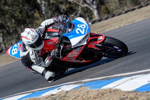 Woman riding a motorcycle on the track