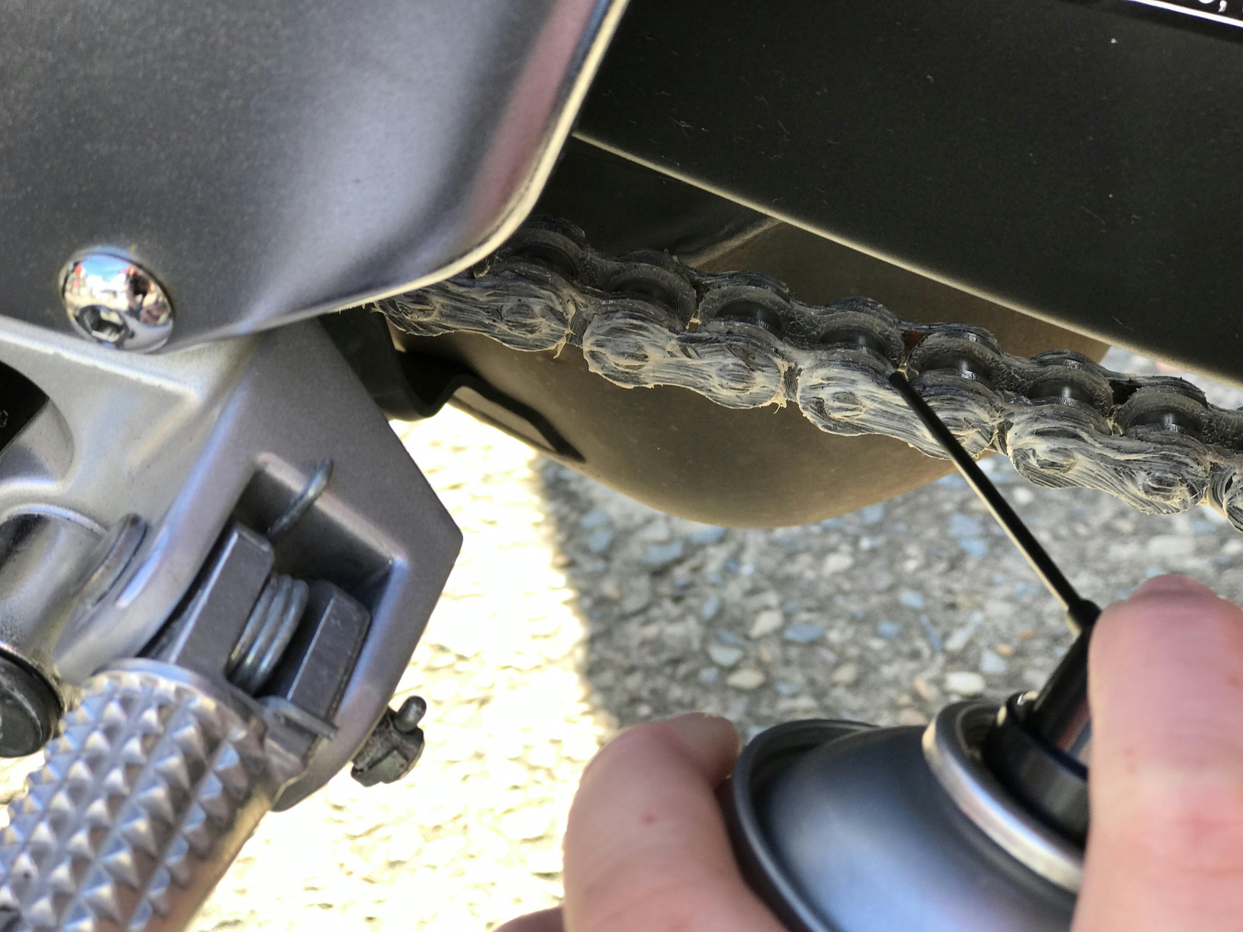 Straw on chain lube chain can being used on a motorcycle