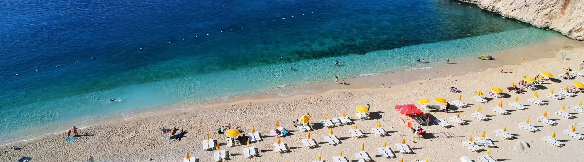 Kaş'taki Kaputaş Plajı'nın turkuaz suyu ve kumsalı, Gaziantep - Antalya otobüs bileti kapak görseli