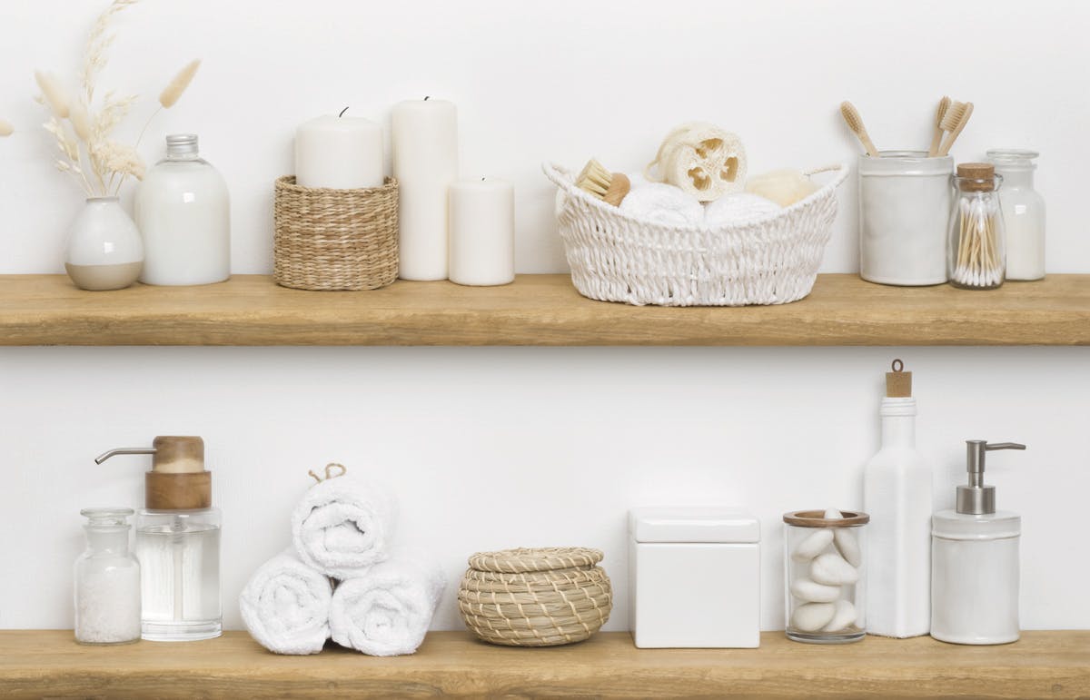 Tips to create an At-Home Spa Bathroom: Declutter, Organize and Create Storage Bathroom organization with containers on shelves