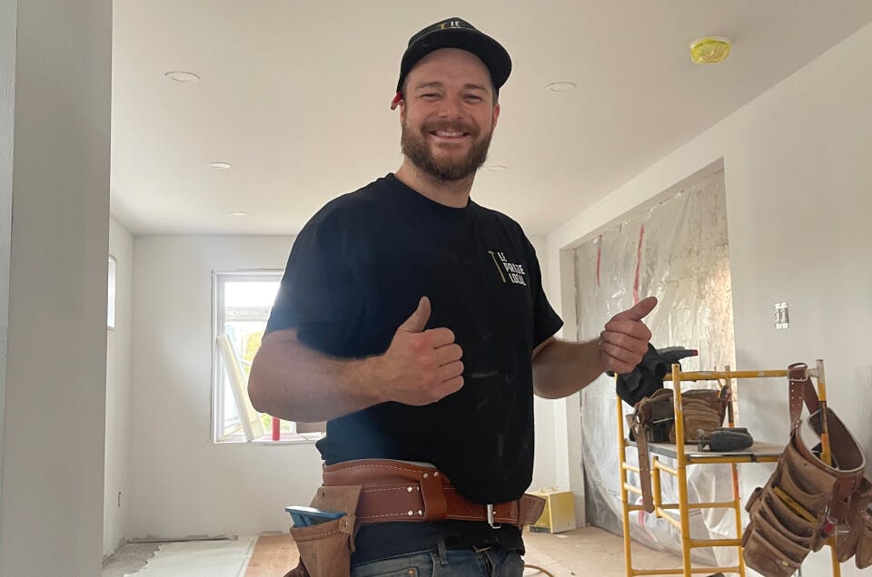 A general contractor smiling