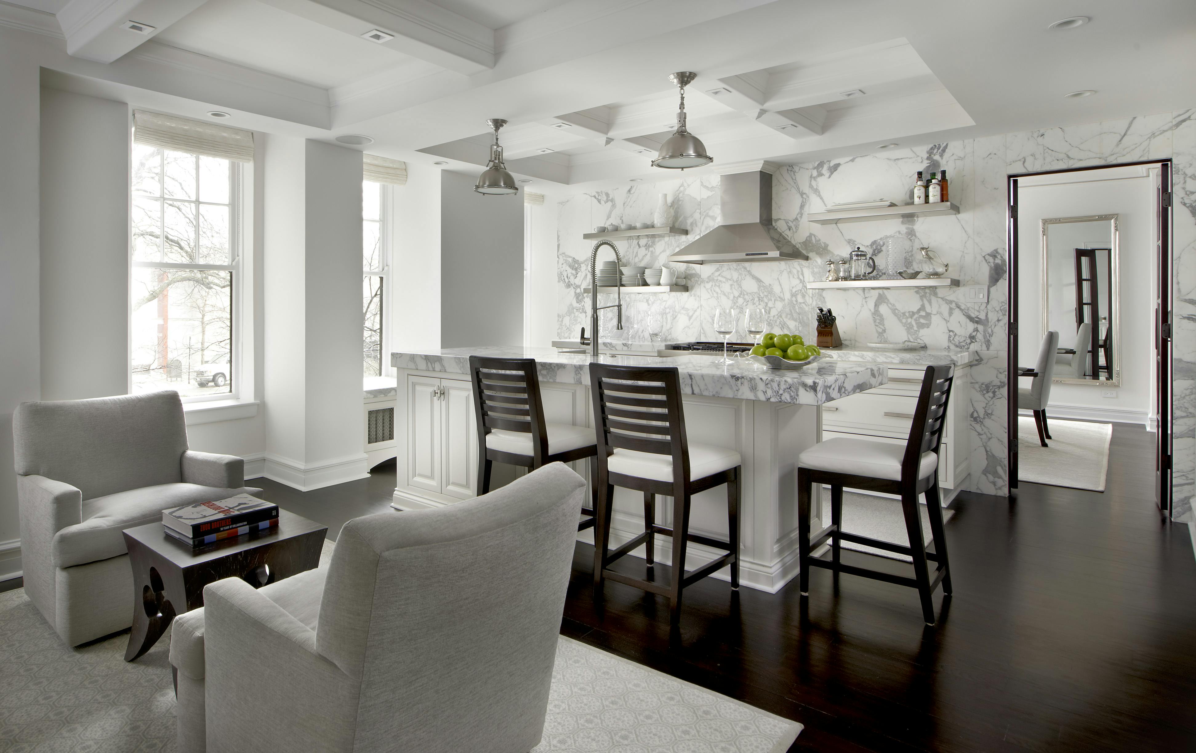 Sleek kitchen with a spacious island and white and gray color palette
