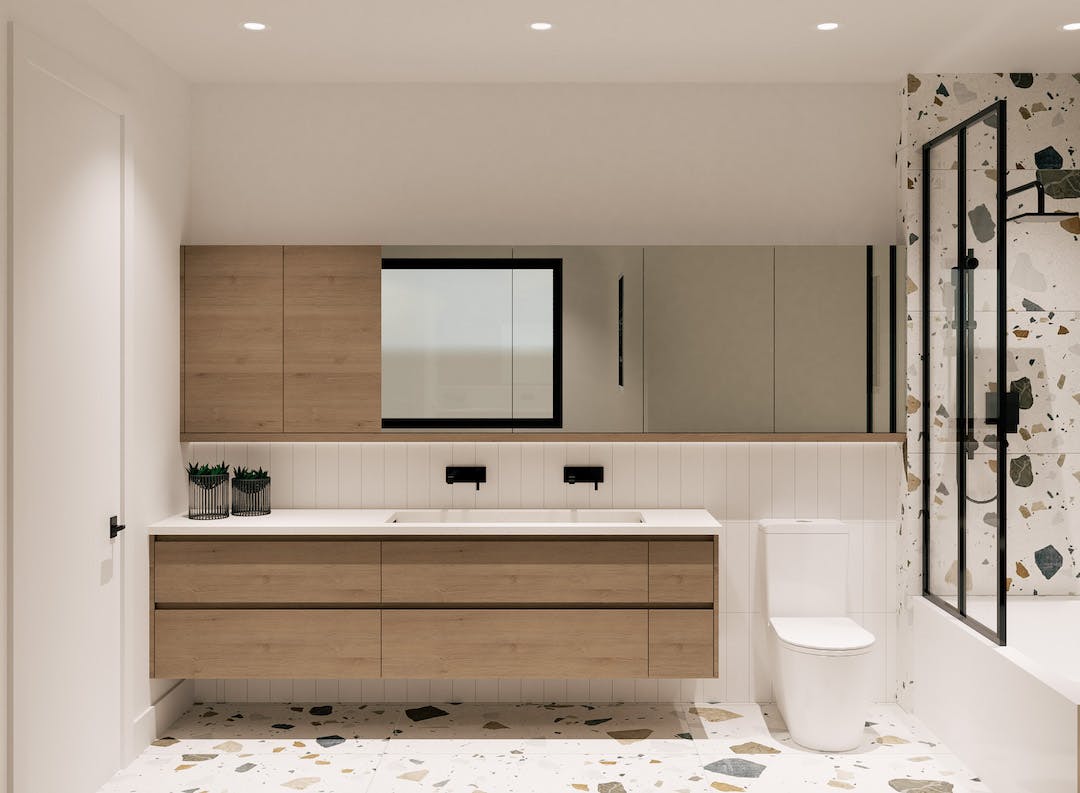 Salle de bain en terrazzo avec armoires en bois de cendre