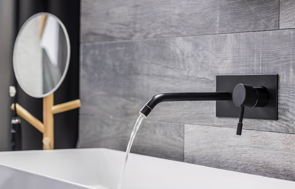 Tips to create an At-Home Spa Bathroom: Treat Fixtures like Jewellery Bathroom with black faucets
