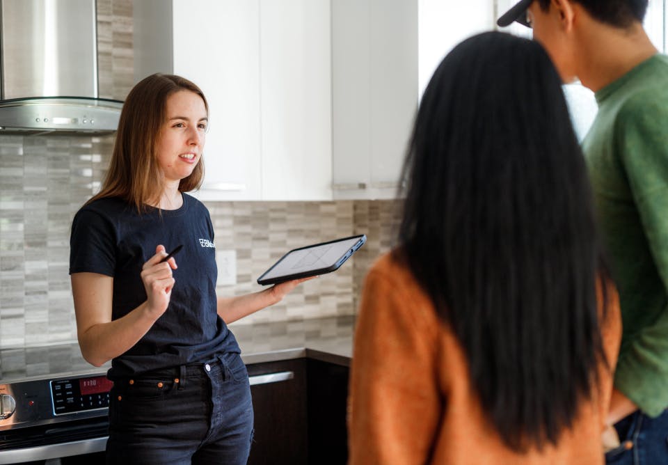 A project manager visiting homeowners