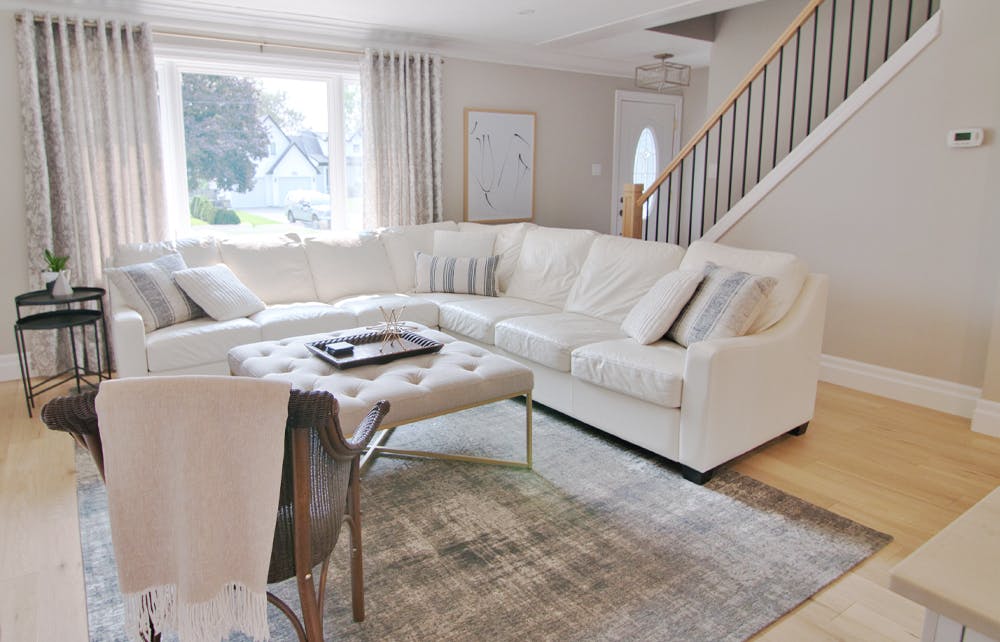 Homeowners who lack private office space opt for temporary ways to improve noise control and privacy in open-plan living areas, says Henry. One of the easiest solutions is to feather your nest with soft furnishings and accessories. Open concept living room