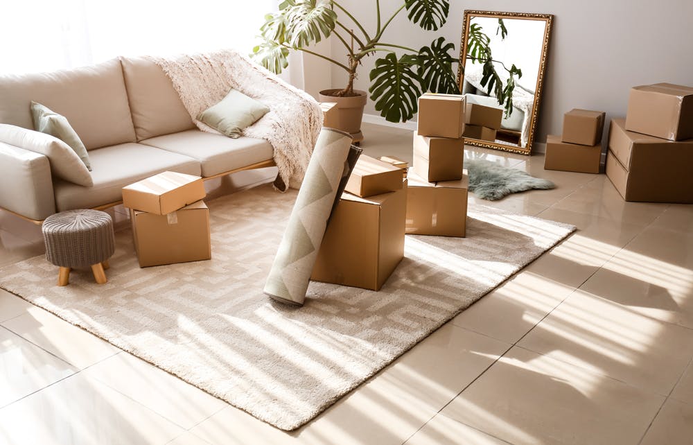 When to move out and move on Living room with packing boxes