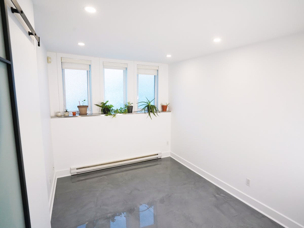 Renovated basement office with new potlights Renovated basement office with three windows