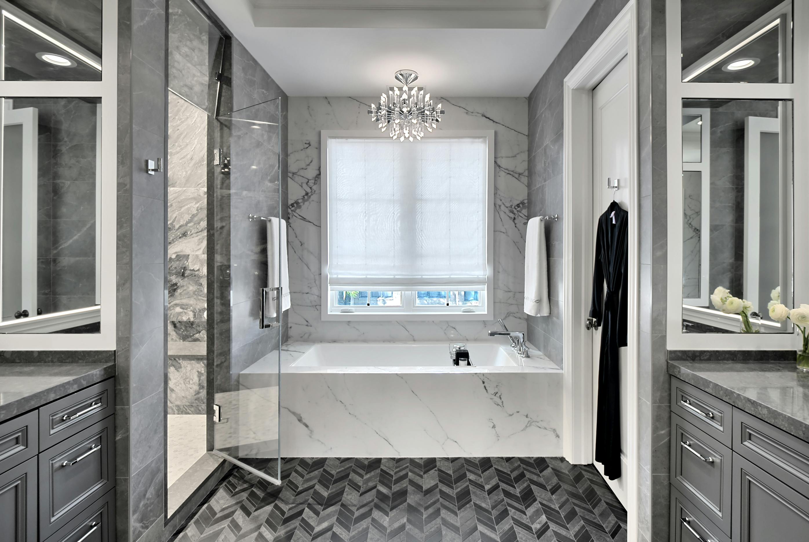 Bathroom with a dark-gray color scheme and marble bathtub