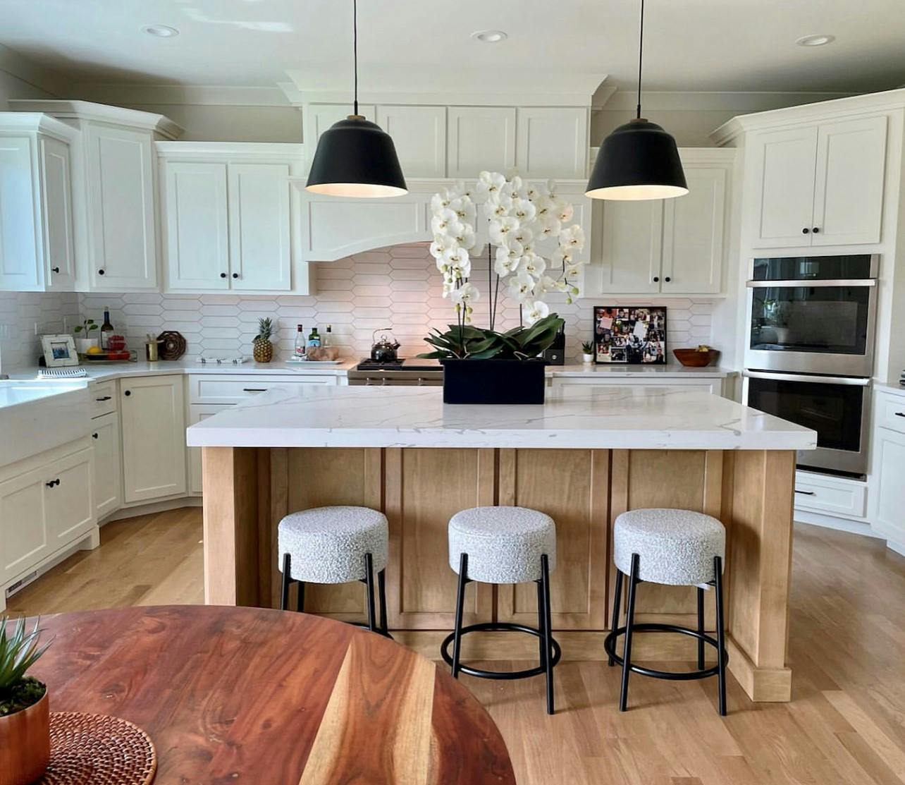 Modern kitchen with a white oak wood finish on the island
