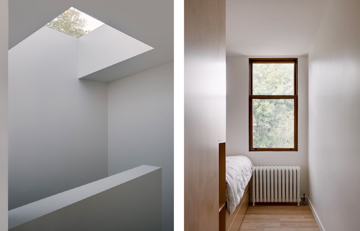 Mezzanine-level primary bedroom Skylight and window letting light in