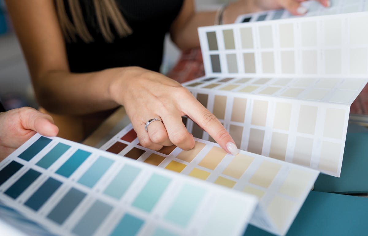 Why select high-end paint for your renovation Couple selecting paint colors