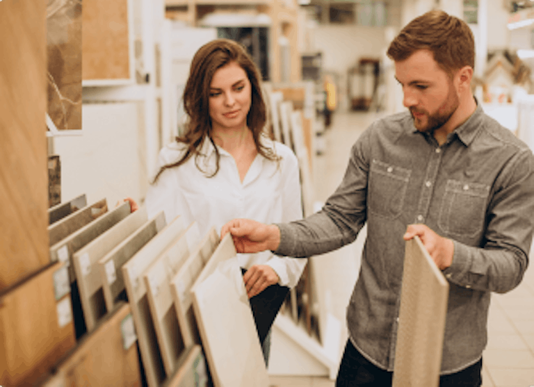 Merchant in a specialty wood store talking with a customer