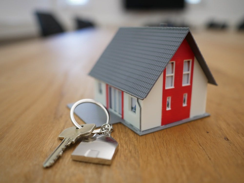 Model House with house keys - Photo by Tierra Mallorca on Unsplash