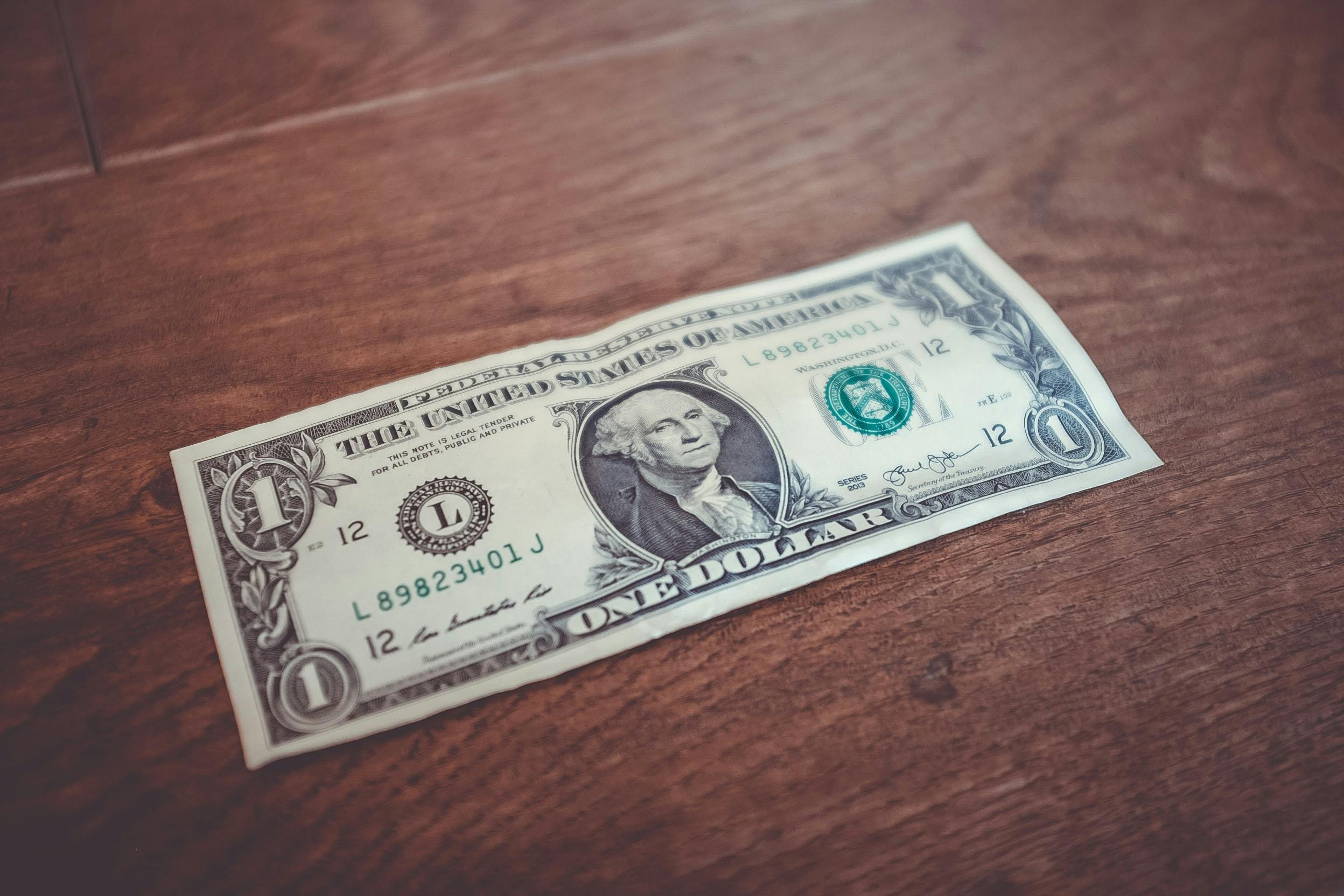 a picture of a dollar - Photo by Kenny Eliason on Unsplash