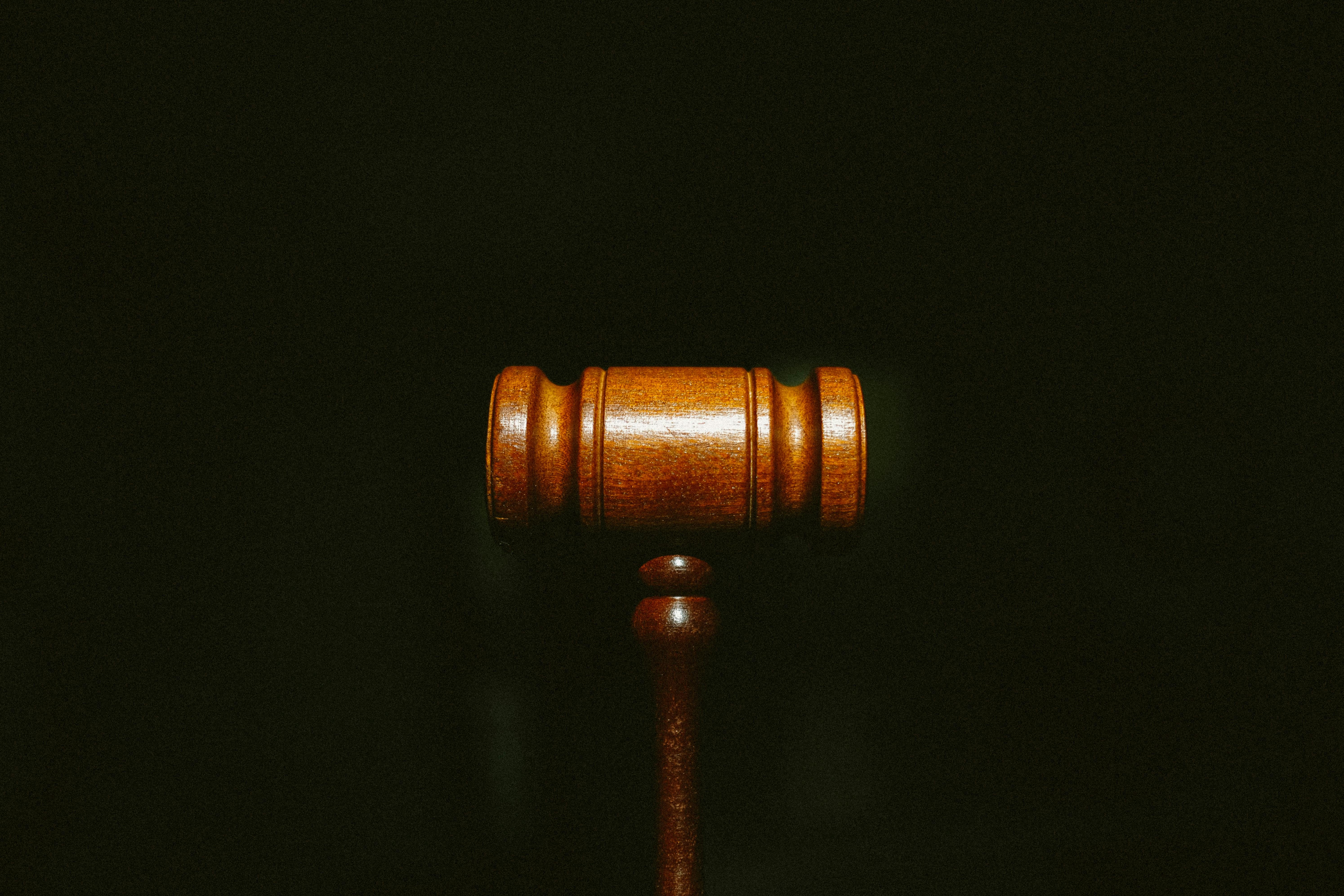 gavel on dark background - Photo by Tingey Injury Law Firm on Unsplash