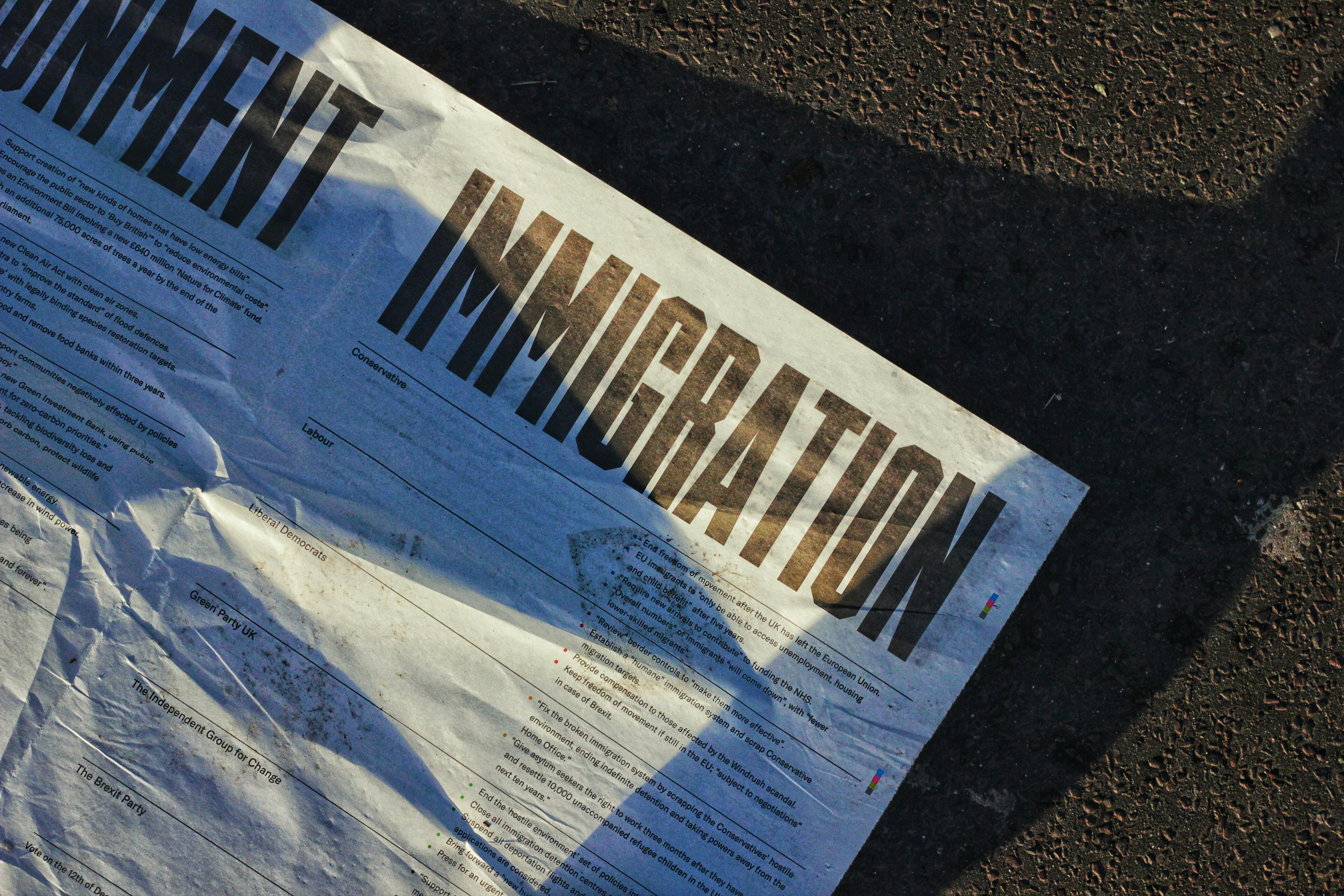 Immigration on Newspaper - Photo by Metin Ozer on Unsplash