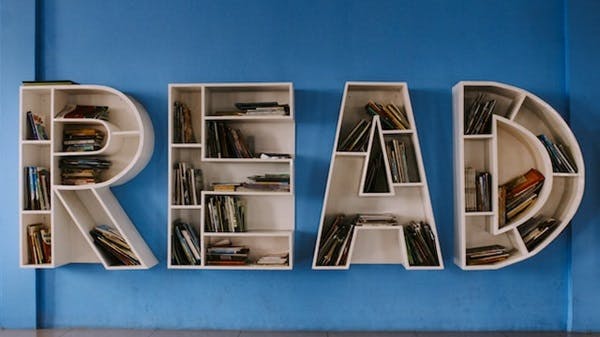 A bookshelf spelling read made out of books